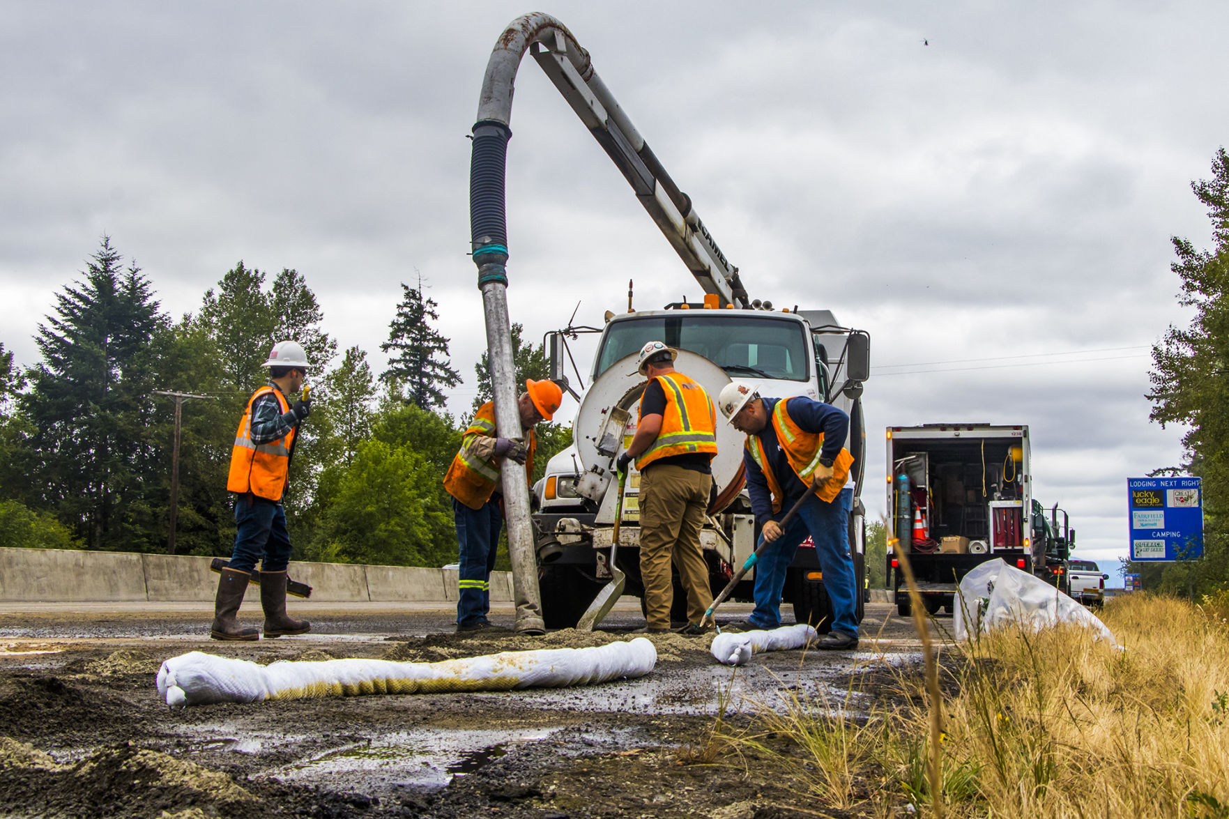 Crews Work To Clean Up Oil After Tanker Overturned